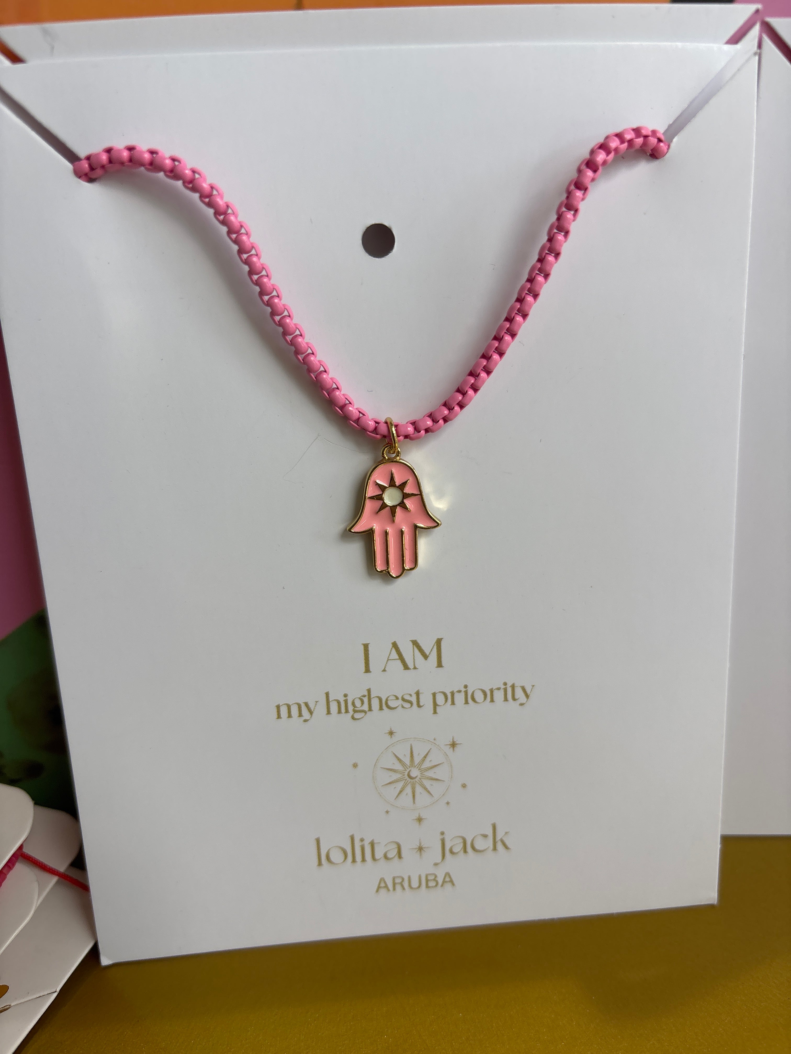 Necklace black with hamsa pink pendant