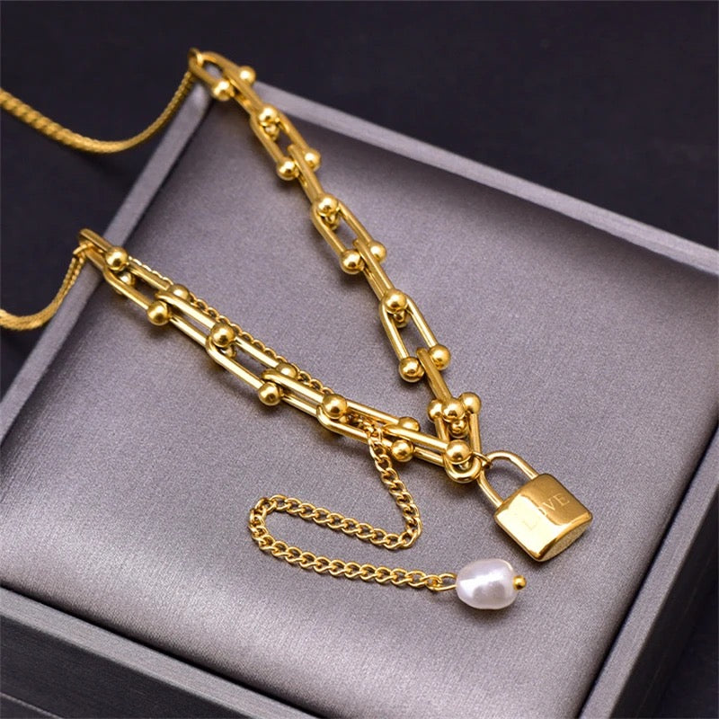 Necklace gold plated lock and pearl pendant