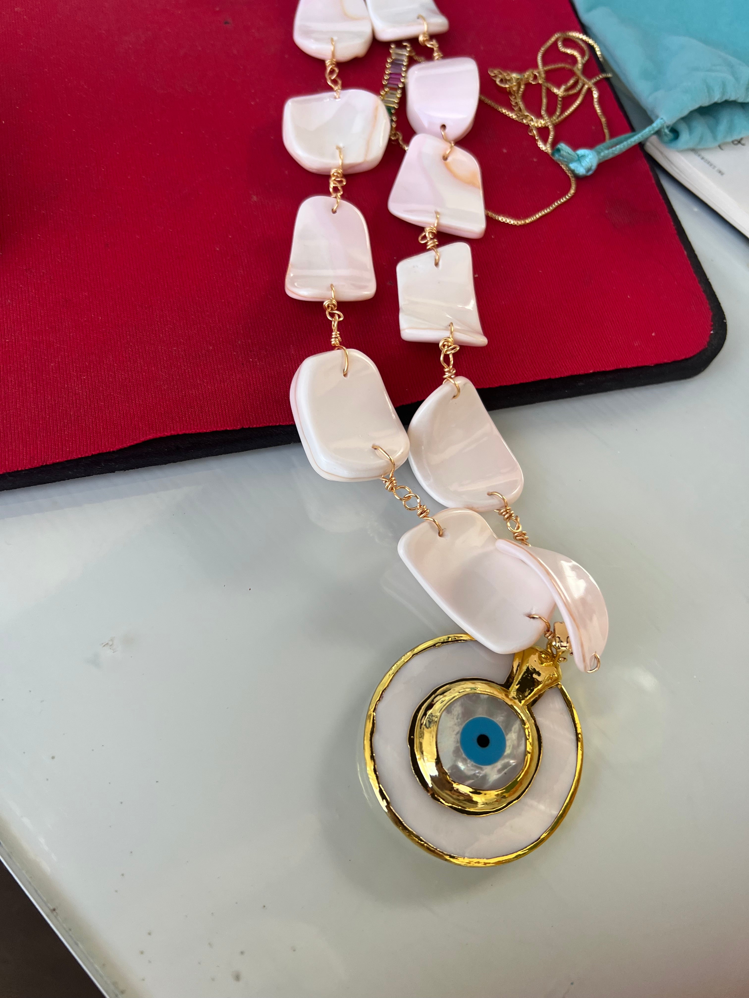 Necklace mother pearl with gold plated pendant evil eye
